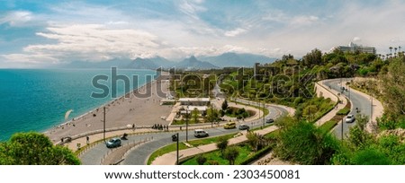 Landscape with road leading to Konyaalti beach in Antalya. Serpentine road paved with stone against the backdrop of mountains. Royalty-Free Stock Photo #2303450081