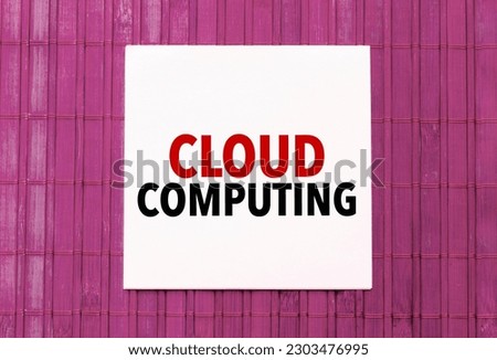 blank note pad with text cloud computing on blue wooden background