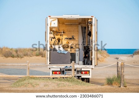 Caravan van taking a break on Trabucador Beach, in the Ebro Delta