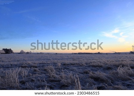 Winter landscape photo. December one morning at sunrise. Snow and frost. Near Skara, Sweden.