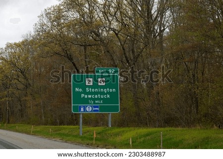 sign on Interstate 95, also called the Jewish War Veterans Memorial Hwy, for exit 92 to Routes 2 and 49 toward North Stonington and Pawcatuck in Connecticut