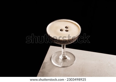 Espresso Martini Cocktail booze vodka, coffee liqueur, espresso and coffee beans Royalty-Free Stock Photo #2303498925