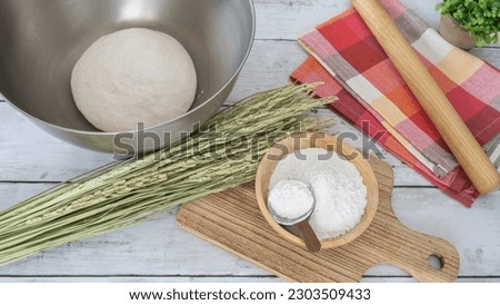 An image of making bread and pizza with rice flour.Rice flour dough in a bowl.