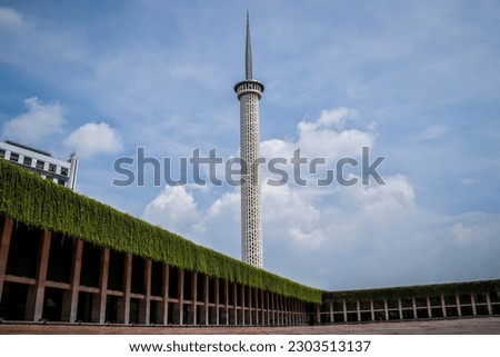 architecture concept with great white minaret of Istiqlal mosque with clear blue sky background located in Jakarta, Indonesia, one of most famous and iconic building in indonesia