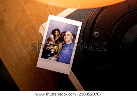 Family photo on the printed picture Royalty-Free Stock Photo #2303520787