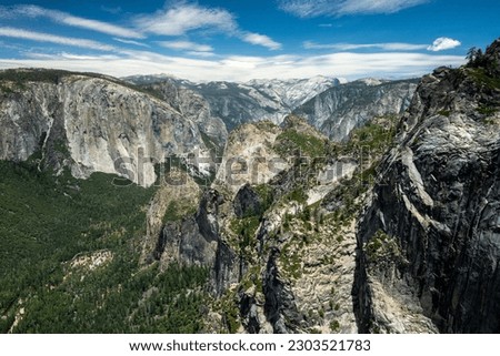 Stanford Point High Above The Valley and Bridalveil Falls Below With El Cap and Half Dome Farther Back Royalty-Free Stock Photo #2303521783