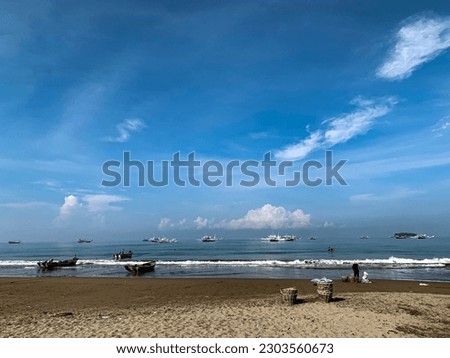 Natural landscape of beautiful tropical beach and sea on a sunny day. blue skies, boats for fishing