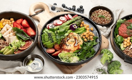 Healthy vegetarian and vegan  salads and Buddha Bowls with vitamins, antioxidants, protein on light  background. Top view, copy space