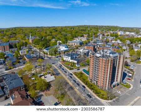 Winslow Towers and historic residential houses in spring in historic town center of Arlington, Massachusetts MA, USA. 