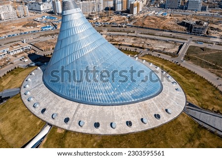 Beautiful panoramic aerial drone view to Nursultan Astana city center with skyscrapers and Khan Shatyr Entertainment Center Royalty-Free Stock Photo #2303595561
