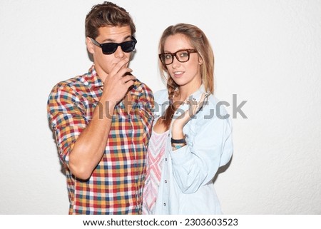 Party portrait of hipster couple on wall background, sunglasses and gen z fashion in university youth culture. Fun, woman and man in picture at college event or cool kids at happy celebration or date