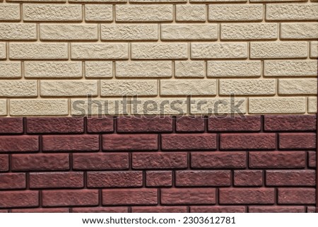 Corner of the stone wall of the building.Brick side.Brick wall texture as a background