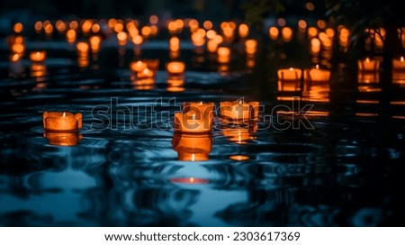 Water lanterns create a magical scene on a lake at night, evoking peace and spirituality. Shallow depth of field.  Royalty-Free Stock Photo #2303617369