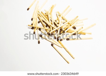 whole matches on a white background. Spread of fire. The whole match is insulated to stop the fire. Stop destruction concept