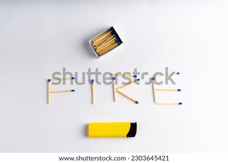 Lighter on white background including matches box, word FIRE