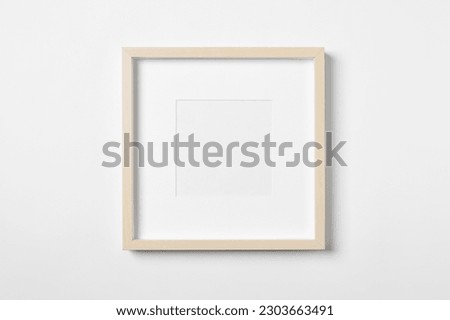 Empty wooden frame on white background. Mockup for design