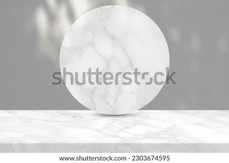 White Marble Table and Circle Marble Partition with Nature Light and Shadow on Concrete Wall Texture Background, Suitable for Cosmetic Product Presentation Backdrop, Display, and Mock up.
