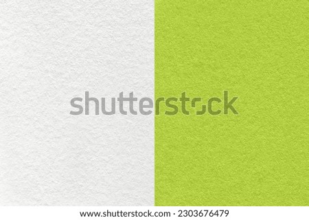 Texture of craft white and gray paper background, half two colors, macro. Structure of vintage dense olive cardboard. Felt backdrop closeup. Royalty-Free Stock Photo #2303676479