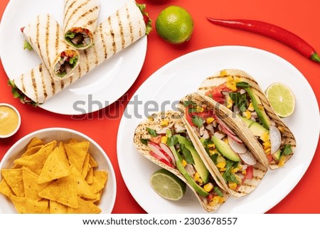 Mexican food featuring tacos, burritos, nachos and more Royalty-Free Stock Photo #2303678557