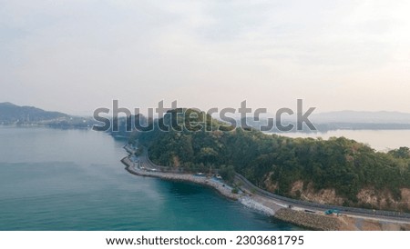 road along the sea, Beach and waves from top view. Turquoise water background from top view. Summer seascape from air. Top view from drone. Travel concept and idea