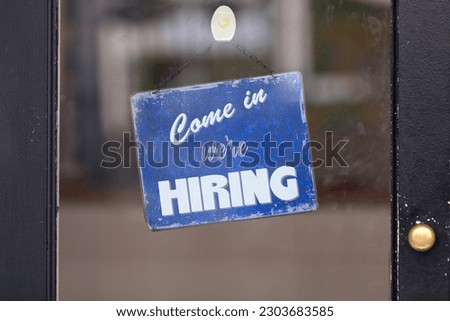 Open sign with written in it: "Come in we're hiring".