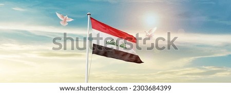 Waving flag of Iraq in beautiful sky. Iraq flag for independence day.