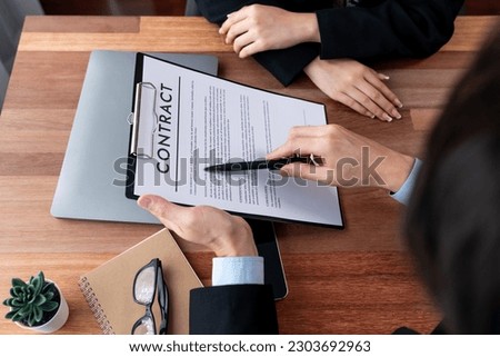 Businessman review agreement document before signing contract. Reading carefully to ensure trade deal align with business goals. Professionalism for business decision making concept. Jubilant