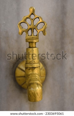 Ancient Water Null from Ottoman empire. Golden water null used in early 18 century. traditional or cultural water null design from ancient Turkey. A gold colour water null is shown in the picture. 