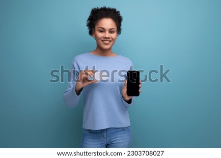 young brunette swarthy skin woman showing smartphone and card mockup