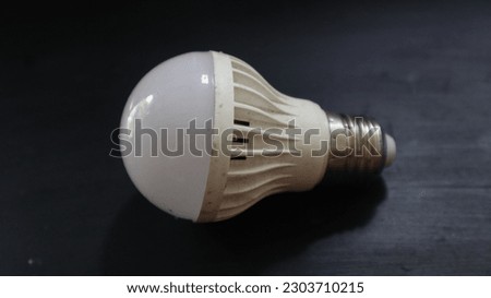 LED light bulb,  

Realistic photo of simple light bulb isolated on black background

