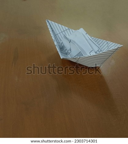Paper boats on the table