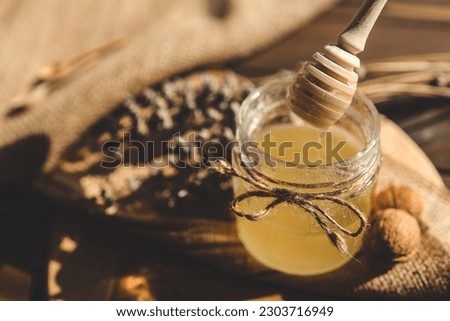 Sweet honey, wooden spoon and lavender, rural aesthetic.