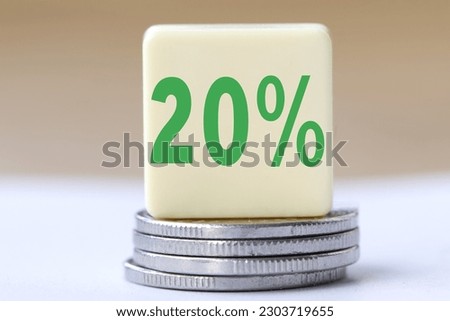 The concept of the word 20 percent on coins. Business concept.