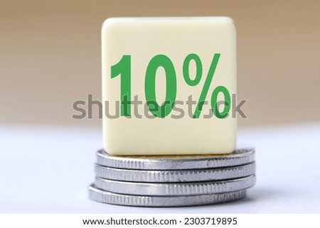 The concept of the word 10 percent on coins. Business concept.