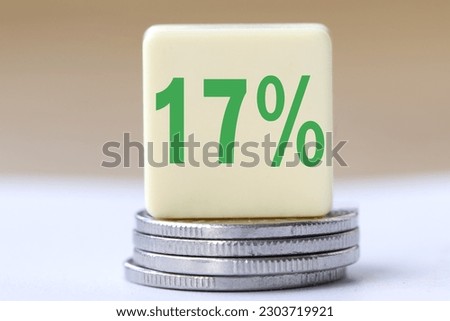 The concept of the word 17 percent on coins. Business concept.