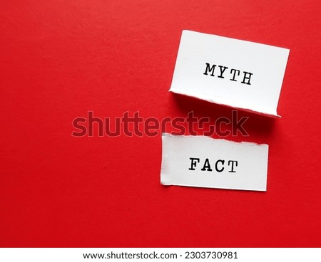 Torn paper on red copy space background with text written FACT and MYTH - Fact based on scientific evidence as proof - Myth from generational thoughts and beliefs Royalty-Free Stock Photo #2303730981