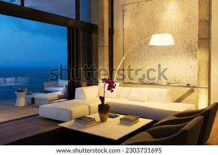 Lamp and sofa in modern living room Royalty-Free Stock Photo #2303731695