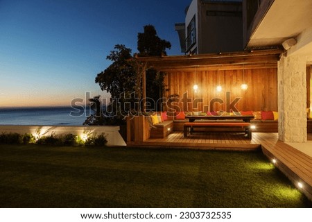 Illuminated luxury patio at night Royalty-Free Stock Photo #2303732535
