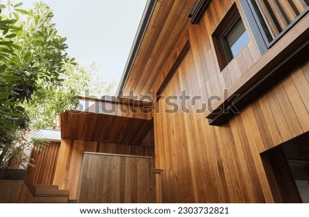 Detail of wood siding on house Royalty-Free Stock Photo #2303732821