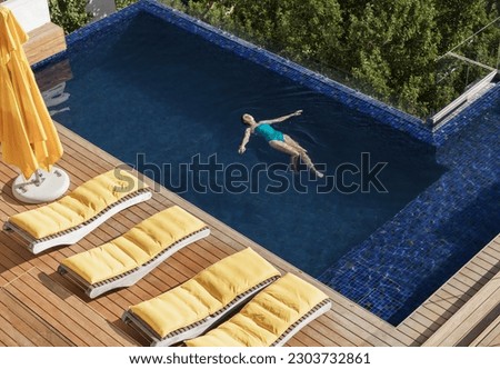 Woman floating in luxury swimming pool