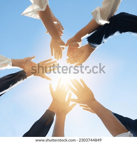 Below hands circle, business people or teamwork by sky background for support, solidarity or goal. Men, women and group with helping hand in air for collaboration, motivation or outdoor team building