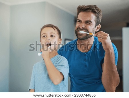 Happy, brushing teeth and father with son in bathroom for morning routine, bonding and dental. Oral hygiene, cleaning and smile with man and child in mirror of family home for self care and wellness Royalty-Free Stock Photo #2303744855