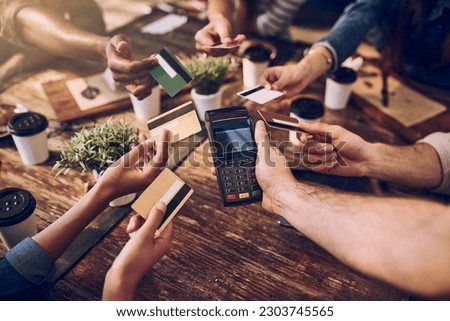 Hands, payment and friends in a cafe, credit card and share bill with offering, online transactions and machine. Closeup, group and people in a restaurant, remote banking and technology with service