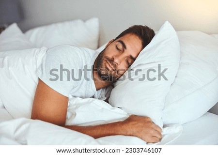 Man, sleeping and bed in morning rest for healthy wellness, peace and quiet on comfort pillow at home. Tired or exhausted male person asleep or dreaming on peaceful holiday or weekend in the bedroom Royalty-Free Stock Photo #2303746107