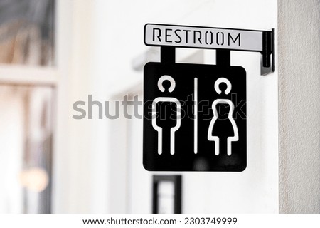 WC Toilet or restroom sign on white door 