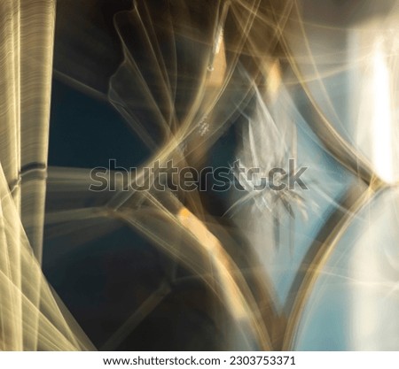 abstract fuzzy blurred golden, yellow, blue and white mysterious festive electrical metallic background