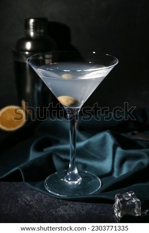 Glass of martini on dark background