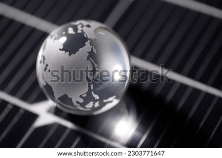 A glass globe placed on a solar panel