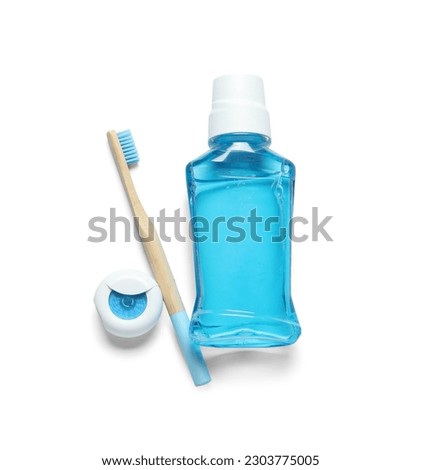 Dental floss, toothbrush and mouthwash isolated on white background Royalty-Free Stock Photo #2303775005