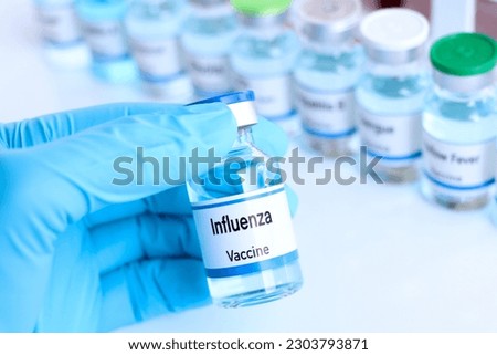 Influenza vaccine in a vial, immunization and treatment of infection, vaccine used for disease prevention Royalty-Free Stock Photo #2303793871
